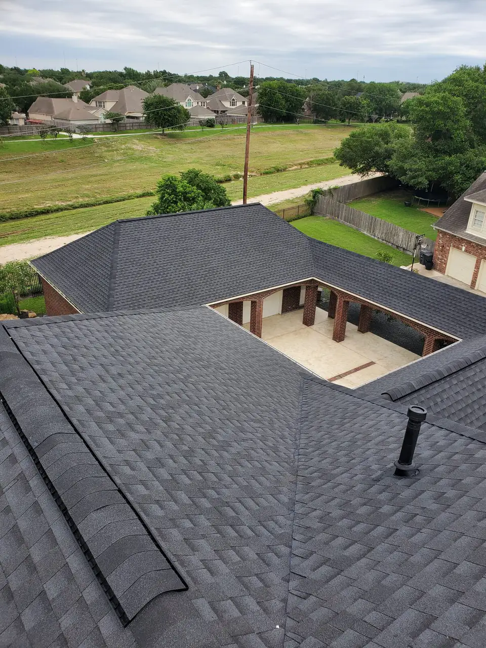 Overhead view of a completed architectural shingle roof