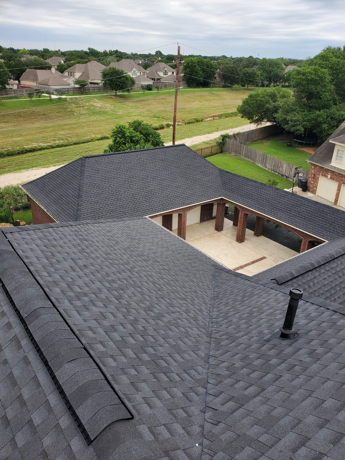 Overhead view of a completed architectural shingle roof